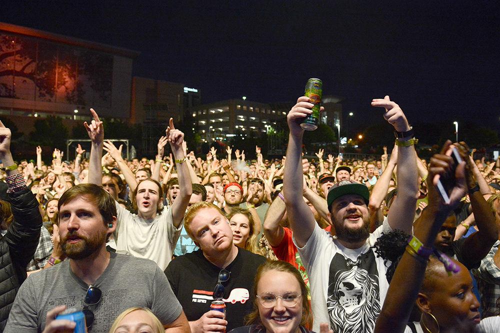 Fans cheer from the pit and throw up the Run the Jewels hand sign. The concert was a part of the Hopscotch Music Festival and took place at Red Hat Amphitheater Friday. The entire festival took place on Thursday through Saturday in downtown Raleigh.