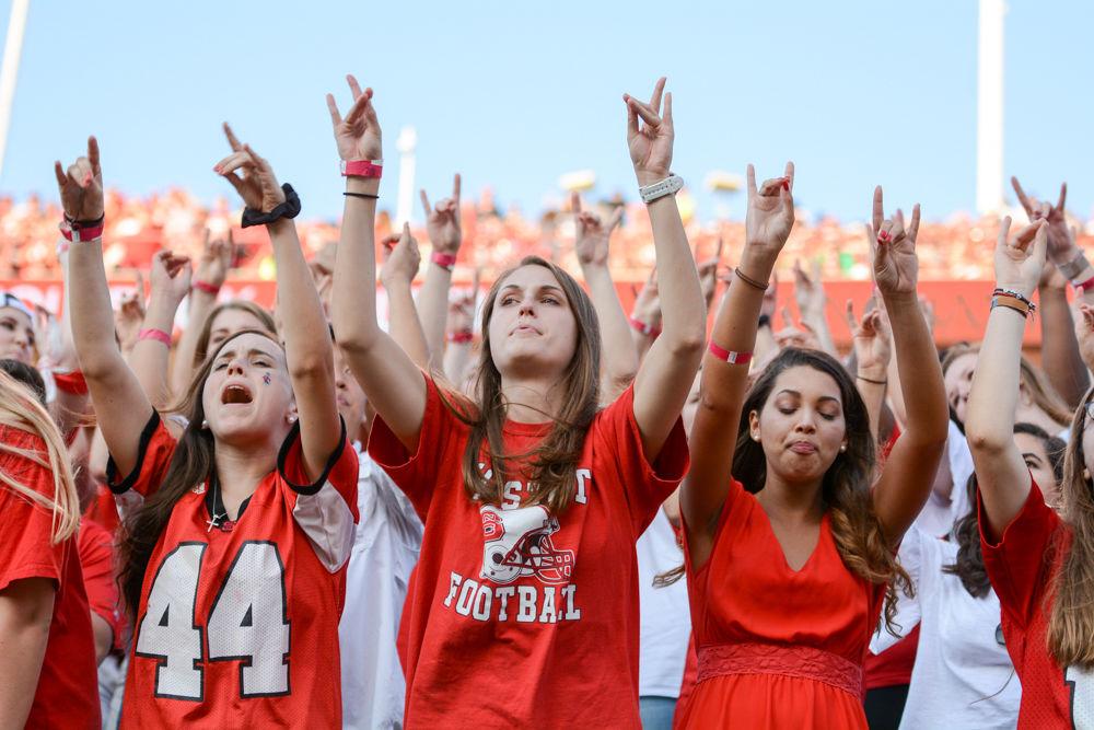 State students put their "wolfies" up as they cheered on the pack to a 37-20 victory over Marshall's Thundering Herd. The game took place in Carter-Finley Stadium at 6pm on Saturday, Sept 9.