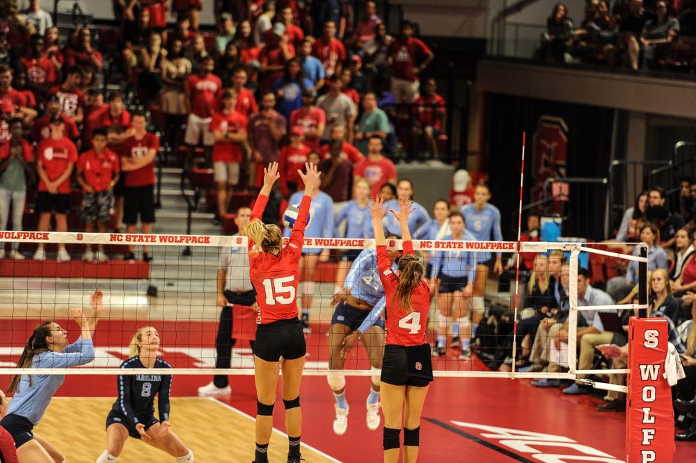 Senior middle blocker Kaitlyn Kearney and Junior setter Kylie Pickrell block a spike. The NC State Women&#8217;s Volleyball Team went on to defeat #11 UNC 3 - 2.