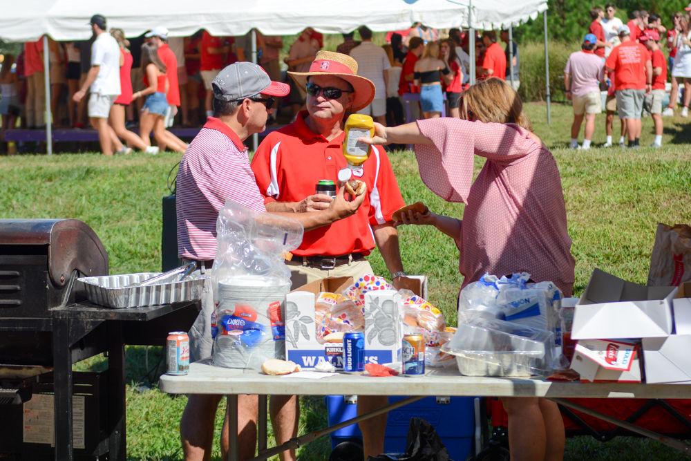Chuck and Cindy Gay and Steve King enjoy tailgating festivities before the NC State and Furman game on Saturday, September 16th. All are parents of current NC State Students in town for the parents and familes weekend.