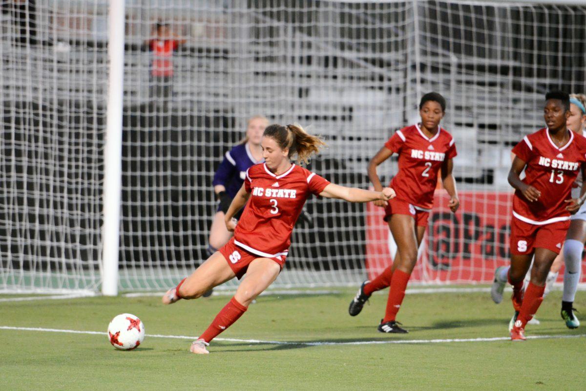 Sophomore defender Krissi Schuster kicks the ball out of the box to prevent a goal by Virginia. The NC State women's soccer team tied Virginia 0-0 in double overtime at Dail Soccer Stadium on Friday, Sep. 15.