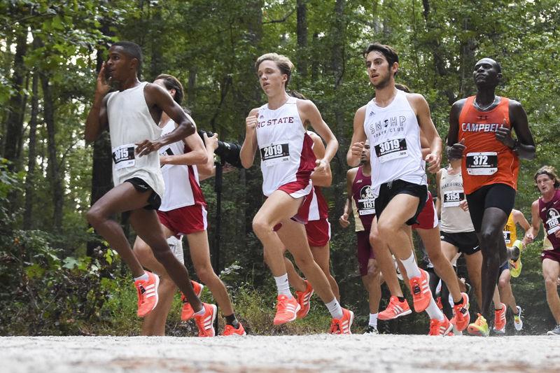 Redshirt freshman cross country runner Ben Barrett rounds the corner with the rest of the field in the men's 6K event of the Adidas XC Challenge at WakeMed Soccer Park Cross Country Course on Sept. 16, 2016. Barrett was the second place finisher for NC State with a time of 18:18.1. The Wolfpack finished second overall beind Florida State.