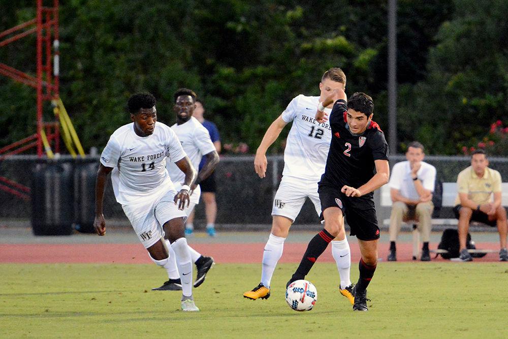 Freshman forward Manny Perez sprints ahead of Wake Forest players. The NC State men's soccer team lost 0-3 to Wake Forest at Dail Soccer Stadium Saturday.
