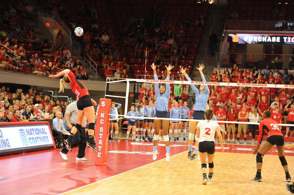 Senior outside hitter Julia Brown spikes the ball. The NC State Women&#8217;s Volleyball Team went on to defeat #11 UNC 3 - 2.