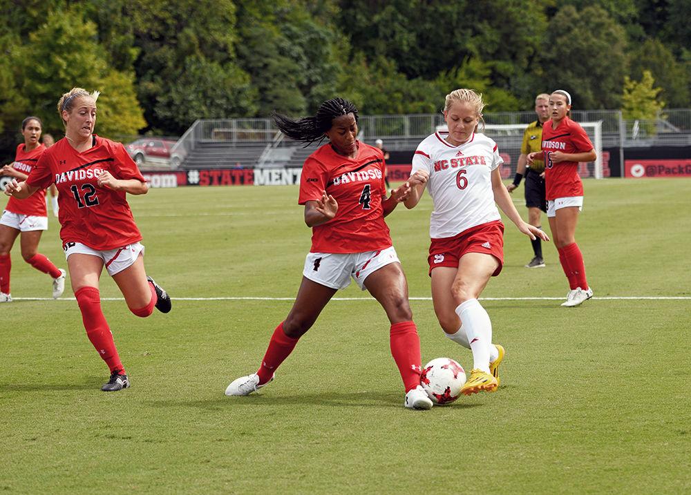 Freshman Defender Lulu Guttenberger steals the ball from a Davidson player. The NC State Women's Soccer Team beat Davidson 4-0 at Dail Soccer Stadium on Sunday, Sept. 10.
