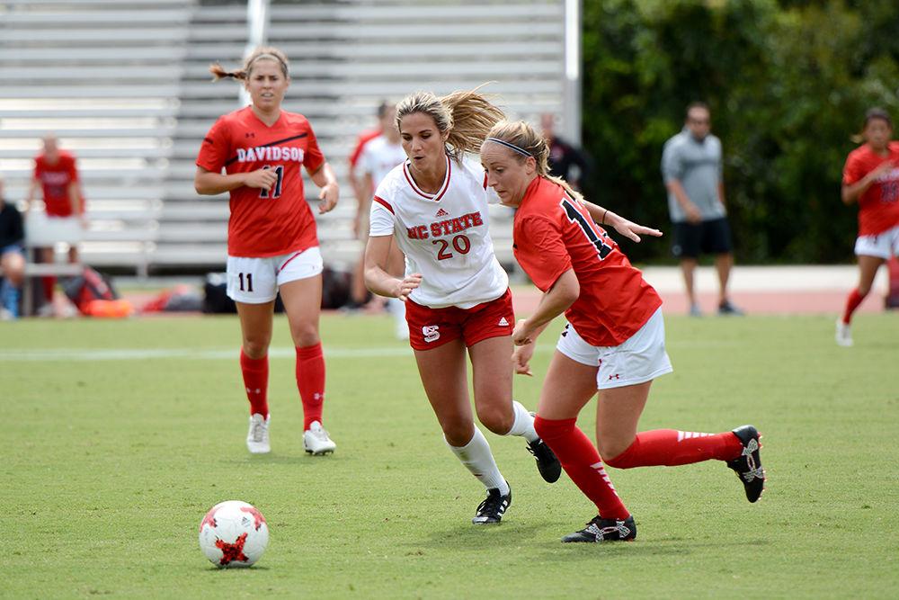 Redshirt senior forward Rachel Cox sprints forward to take the ball from a Davidson player.&#160; Cox had a great game, taking three shots and making two. The NC State women&#8217;s soccer team beat Davidson 4-0 at Dail Soccer Stadium Saturday.