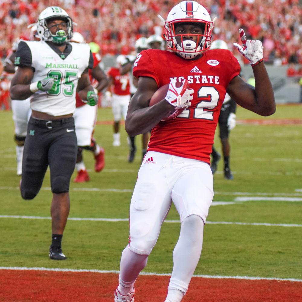 Redshirt junior wide reciever, Stephen Louis, throws up a number one to celebreate a Wolfpack touchdown in Carter-Finley Stadium. When asked about the game for the team he said "It feels good to break that tackle and it feels good to get that win." The Wolfpack went on to defeat Marshall 37-20 on Saturday Sept. 9.