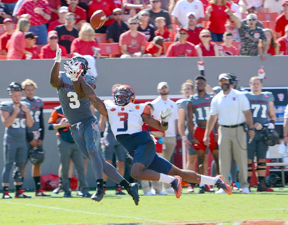 Sophomore X-reciever Kevin Harmon attempts to receive the ball. The NC State football team beat Syracuse 33-25 at Carter-Finley Stadium on Saturday.
