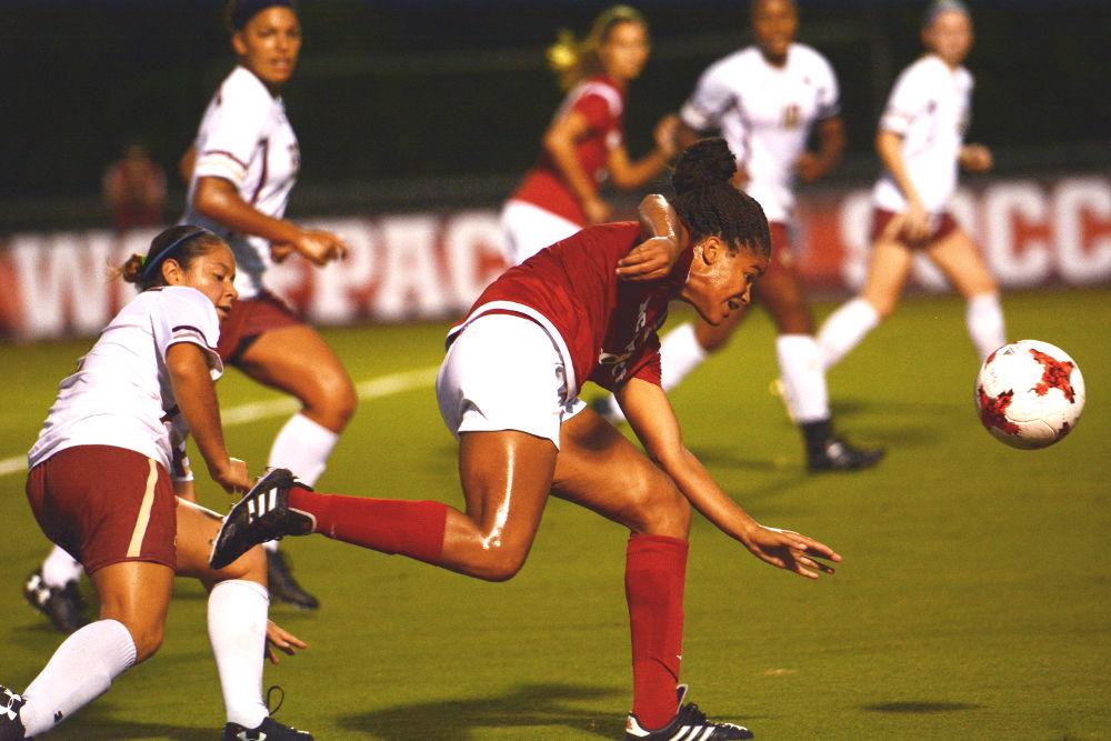 Sophomore forward Kia Rankin fights for the ball. The Women's Soccer team ended the game with a victory with a 1-0 score at Dail Stadium on Thursday.