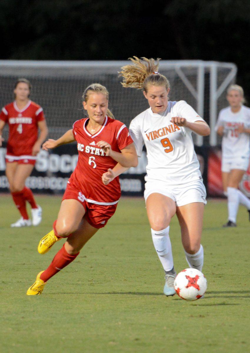 Freshman defender Lulu Guttenberger fights for possession of the ball. The NC State women's soccer team tied Virginia 0-0 in double overtime at Dail Soccer Stadium on Friday, Sep. 15.