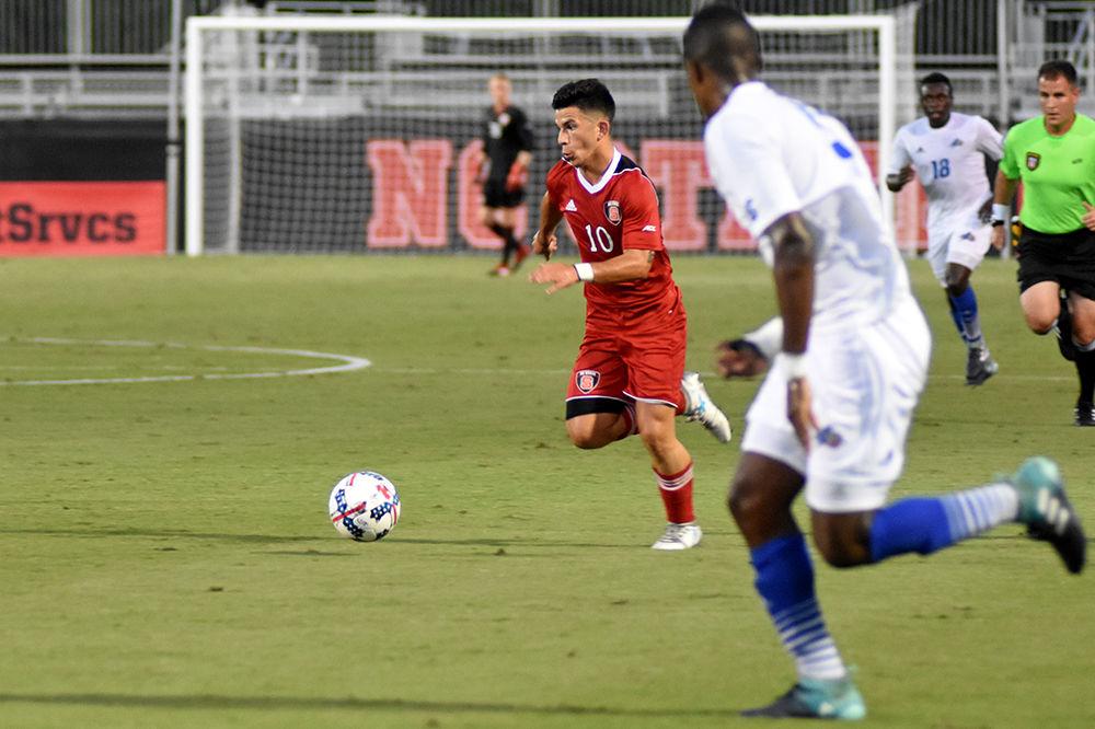 Freshman forward David Loera carries the ball up-field against the UNC Asheville Bulldogs. The Wolfpack won 3-0 in Dail Soccer Stadium on Tuesday.