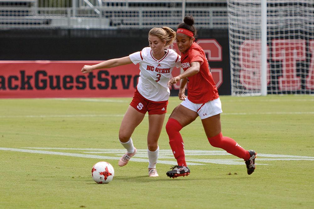 Sophomore defender Krissi Schuster dribbles the ball while shielding the ball from a Davidson player. The NC State women's soccer team beat Davidson 4-0 at Dail Soccer Stadium on Sunday, Sept. 10.
