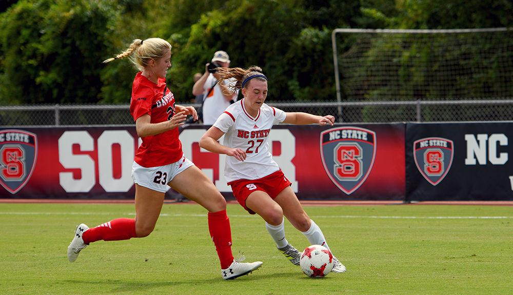 Freshman Midfielder Naomi Powell dribbles the ball around a Davidson player. The NC State women's soccer team beat Davidson 4-0 at Dail Soccer Stadium on Sunday, Sept. 10.