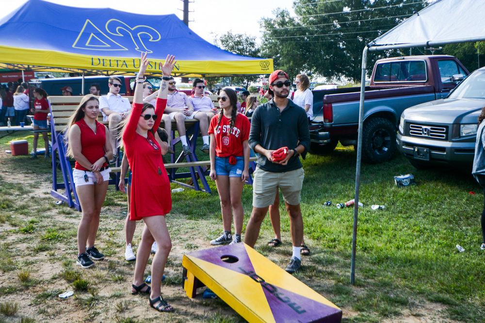 Anna Marin, a second year studying art and design, and Sam Fox, a second year studying biomedical engineering, participate in one of the many fun games outside Carter-Finley a few hours before kickoff. The game took place at 6pm on Saturday, Sept 9, against Marshall's Thundering Herd.
