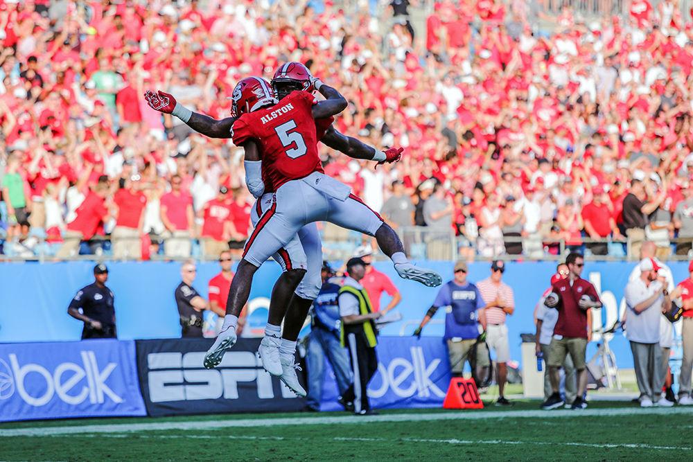 Redshirt senior cornerback Johnathan Alston celebrates with sophomore wide receiver Kelvin Harmon after a sack for nine yards. Alston put up both an interception and a sack during the 35-28 loss to South Carolina on Saturday, Sept. 2 in the Bank of America Stadium for the Belk College Kickoff game.