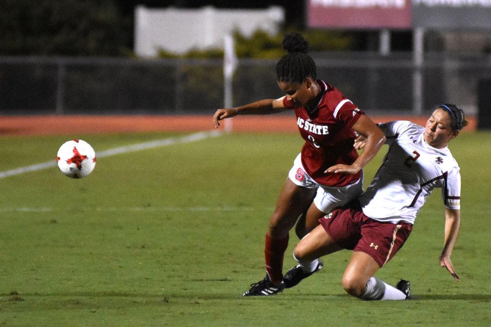 Sophmore forward Kia Rankin gets tackled by a Boston College defender during the game in Dail Soccer Stadium. The Wolfpack would win 1-0 on Thursday.