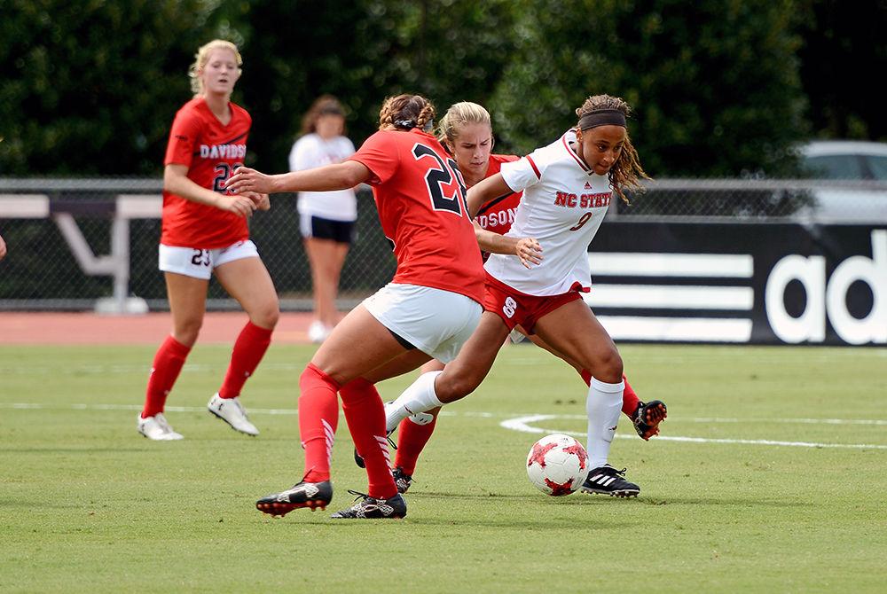 Junior foward Maxine Blackwood breaks away from Davidson players. The NC State women's soccer team beat Davidson 4-0 at Dail Soccer Stadium on Sunday, Sept. 10.
