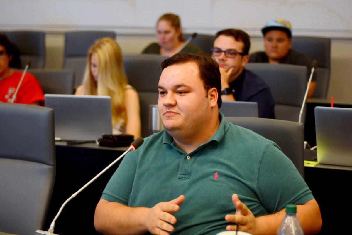 Sean Harrington, a fourth-year studying political science, discusses the senate referendum that increases Student Health Services's budget for the 2018-2019 school year. Student senators and members voted on fee increases in the Student Senate Chamber on Wednesday, Sept. 27.