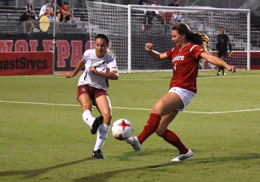 Junior defender Hannah Keogh challenges a Boston College defender during the game in Dail Soccer Stadium. The Wolfpack would win the game by a score of 1-0 on Thursday.