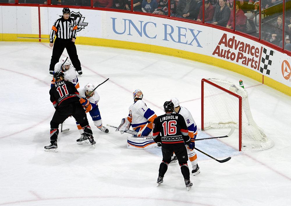 Hurricanes forward Jordan Staal tips the puck in against the Islanders in PNC Arena on Jan. 14. The Hurricanes defeated the Islanders 7-4.