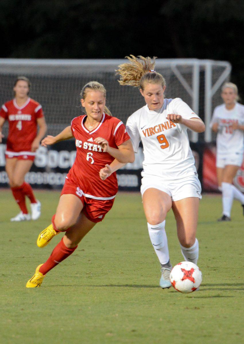 Freshman defender Lulu Guttenberger fights for possession of the ball. The NC State women's soccer team tied Virginia 0-0 in double overtime at Dail Soccer Stadium on Friday, Sep. 15.