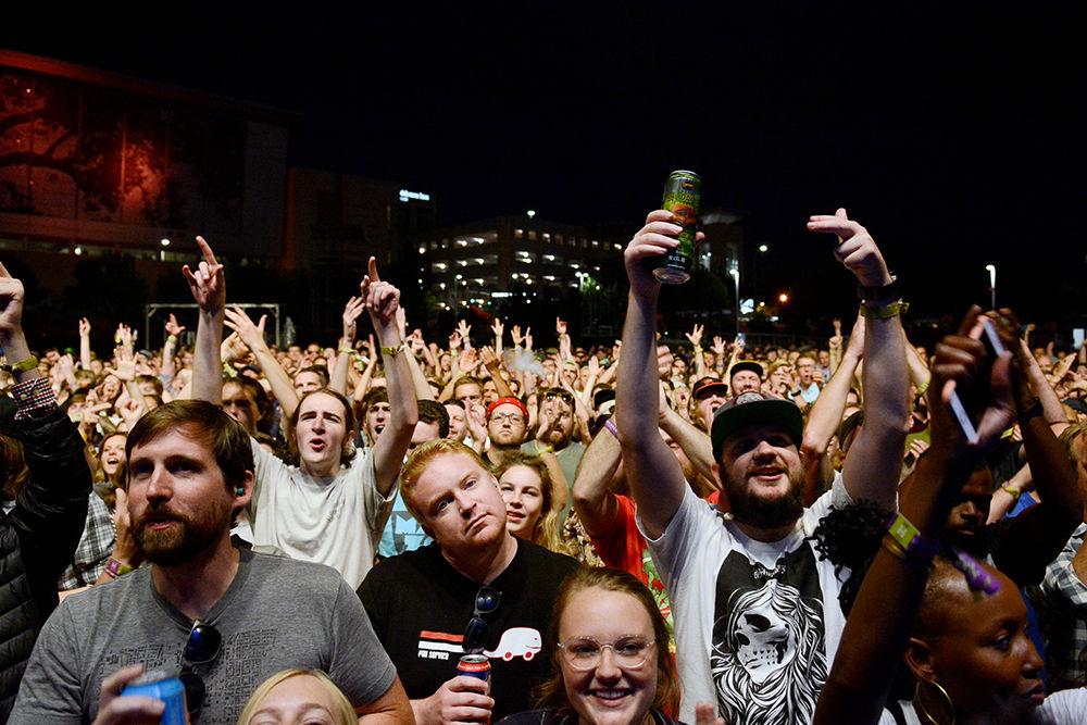 Fans cheer from the pit and throw up the Run the Jewels hand sign. The concert was a part of the Hopscotch music festival and took place at Red Hat Amphitheater on Sept. 9. The entire festival took place on Sept. 8-10 in downtown Raleigh.