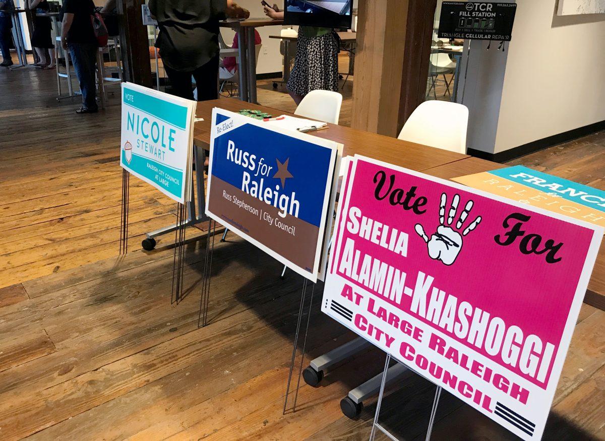 Yard signs representing various municipal election candidates on display at a town hall event hosted downtown by HQ Raleigh on Thursday, Sept. 21.