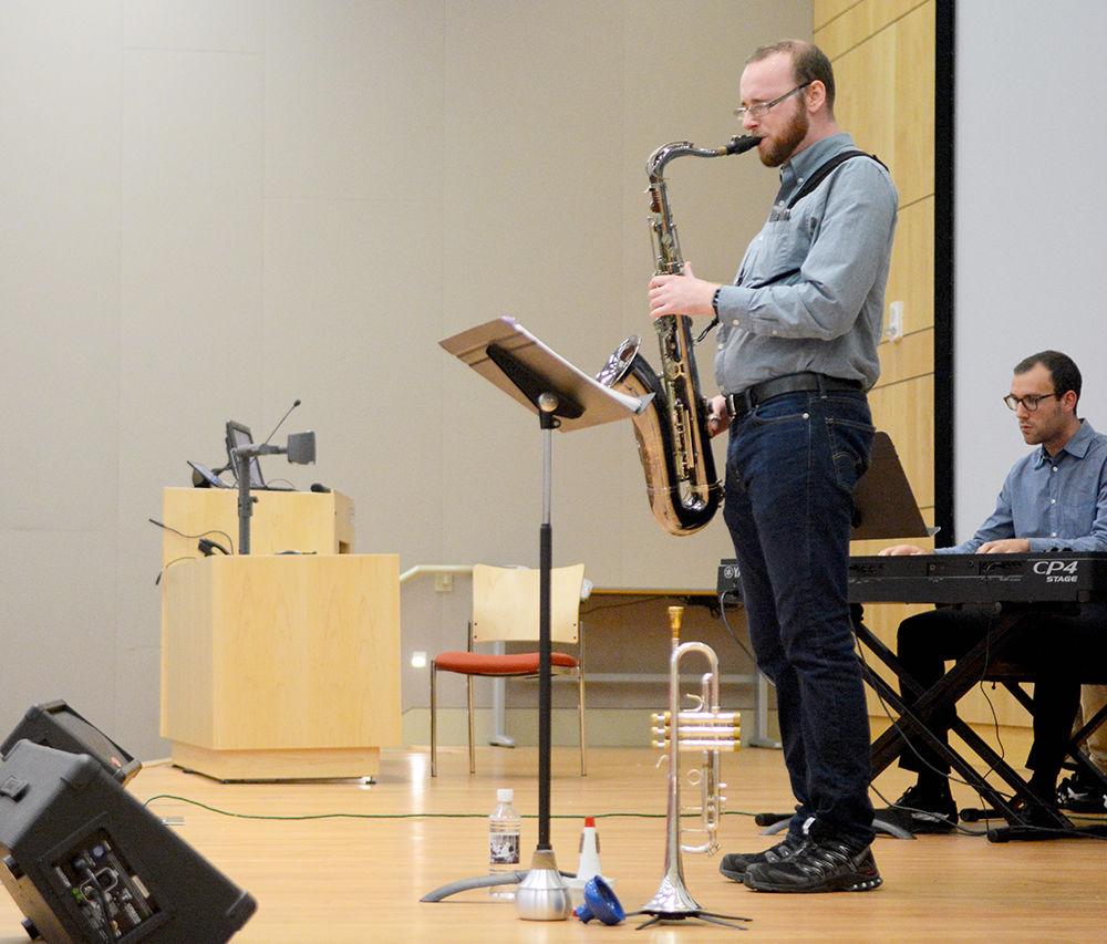 Carter Harris, a third-year doctoral student studying Electrical and Computer Engineering, plays the saxophone before the screening of "Chasing Trane." The African American Cultural Center hosted the event in the Hunt Library Auditorium on Friday, Sept 1. This screening was the first of six, the rest of which will be hosted in Witherspoon Cinema.