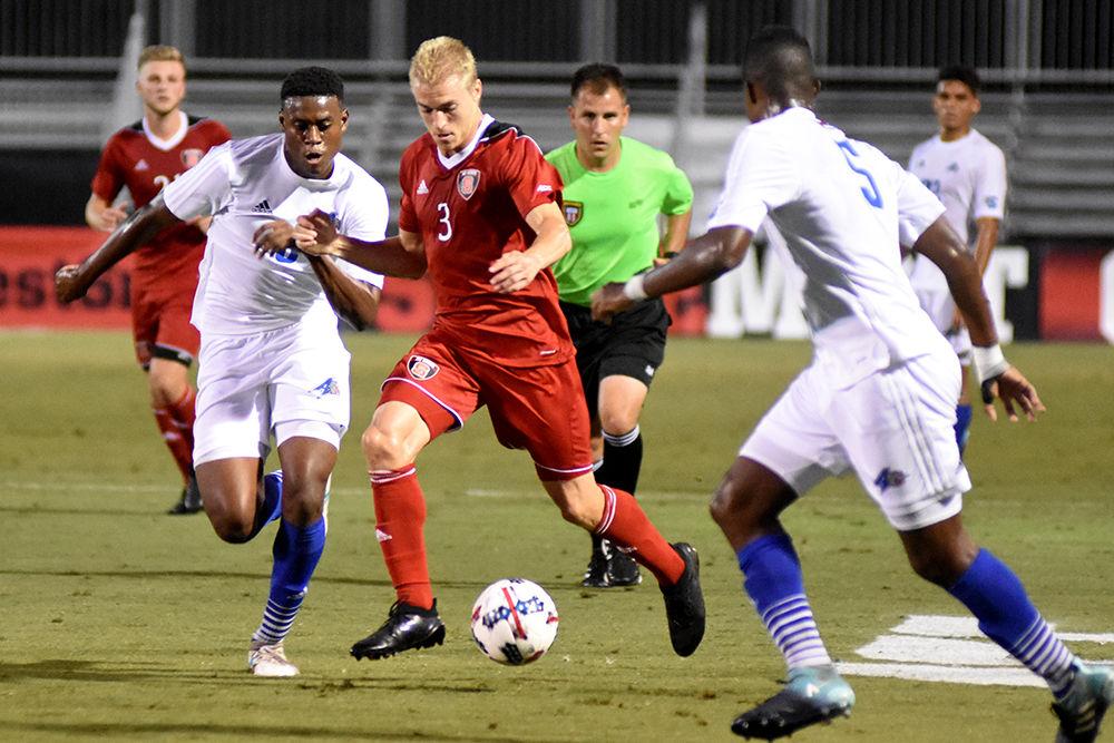Senior defender Caleb Duvernay battles for possession of the ball during the game against UNC Asheville. The Wolfpack won 3-0 on Tuesday in Dail Soccer Stadium.