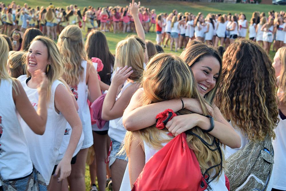 Several girls hug and celebrate during Bid Day on Tuesday in the center of Greek Village. Those rushing found out if they had been invited into one of the sororities on campus. Bid Day was the last event of Rush Week.