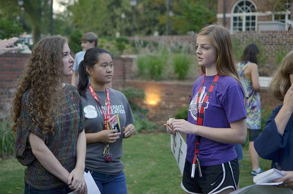 Devin Wyatt, a first-year studying environmental engineering, networks with Sandy Lin and Zohara Scott at the Bees' Needs event at the Gregg Museum of Art and Design on Thursday.