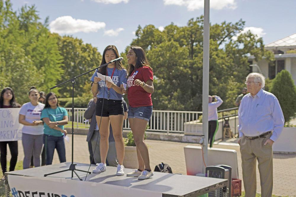 Event organizers Jasmine Wang and Sindhoor Ambati talk to DACA supporters at a rally with Congressman David Price waiting to address the crowd in downtown Raleigh on Sunday. Ambati and Wang are both second year NC State students. Wang is studying computer science and Ambati is studying English and biomedical engineering.