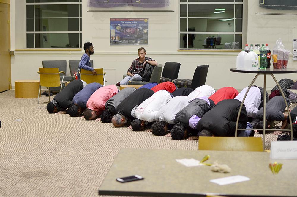 Members of the Muslim Student Association and the Islamic Association of Raleigh pray during the Islam Fair on Tuesady. This event was held as part of Diversity Education Week to help raise awareness about the Islamic culture as well as answer any questions that people may have.