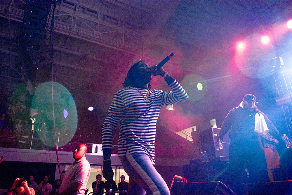 Rapper K Camp heads across stage as he preforms. The NC State Homecoming Concert is organized by UAB as a part of Red and White week at NC State. The concert took place at Reynolds Coliseum on Friday, Oct. 27.