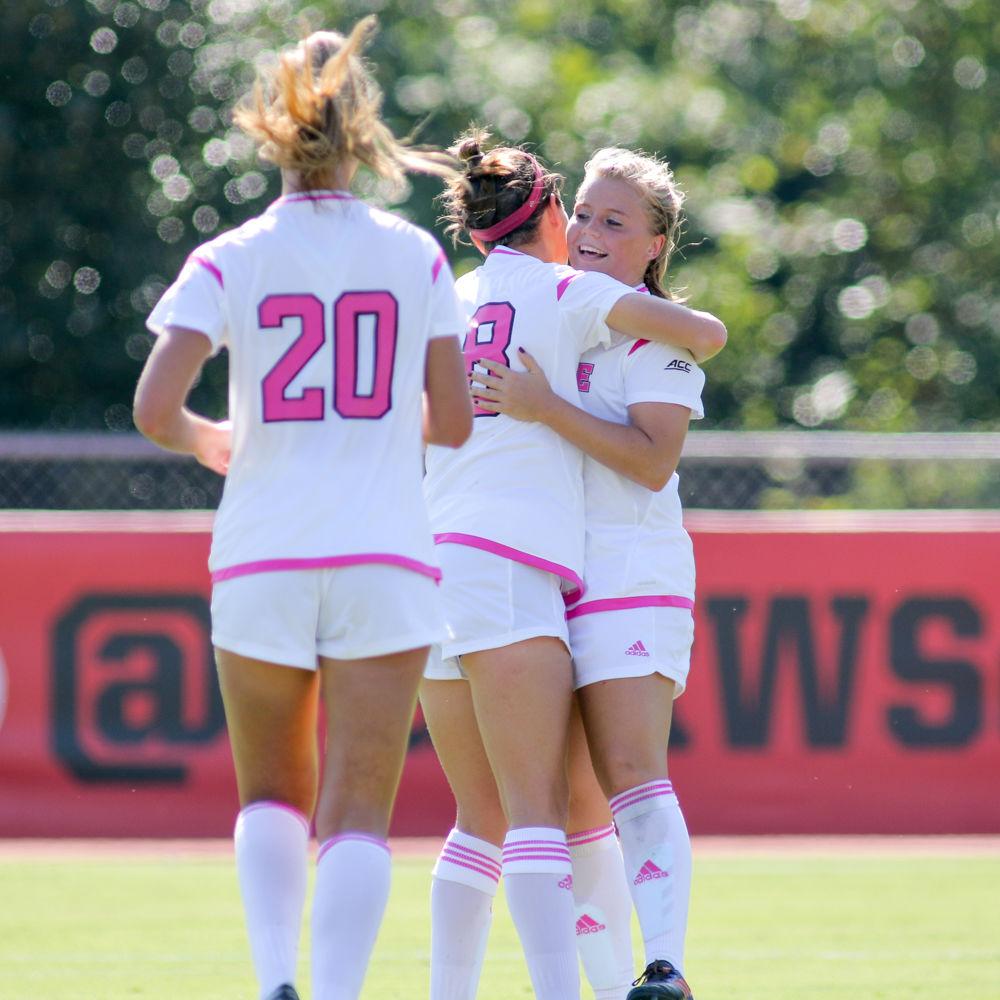 Sophomore midfielder Ricci Walking is hugged by sophomore midfielder Frances Henshall after scoring in th 35th minute. Walking had three of the Pack's 16 shots, out-shootin Syracuse 16-4 during the 3-0 win over Syracuse on Saturday, Oct 14 in Dail Soccer Stadium.