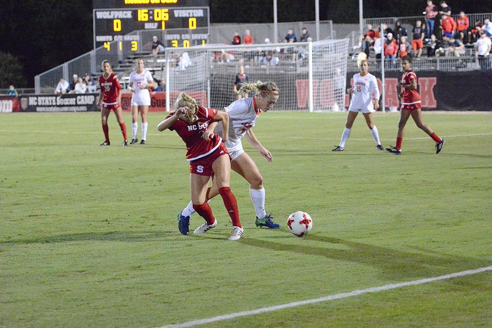 Sophomore midfielder Paige Griffiths fights with a defender during the game against the Tigers. The Wolfpack would go on to win the game 1-0 in Dail Soccer Stadium on Thursday.