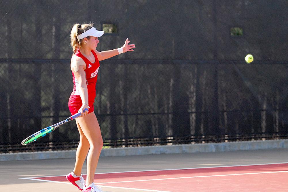 Sophomore Amanda Rebol returns a volley against opponent Daniela Ruiz at the N.C State vs Clemson tennis match at J.W. Isenhour Tennis Center on Fri. Mar. 31st, 2017. Rebol defeated opponent Ruiz after two sets scoring 6-0 and 6-2 respectively. N.C State won over Clemson scoring 6-1 and only losing one singles and one doubles match against the Tigers.