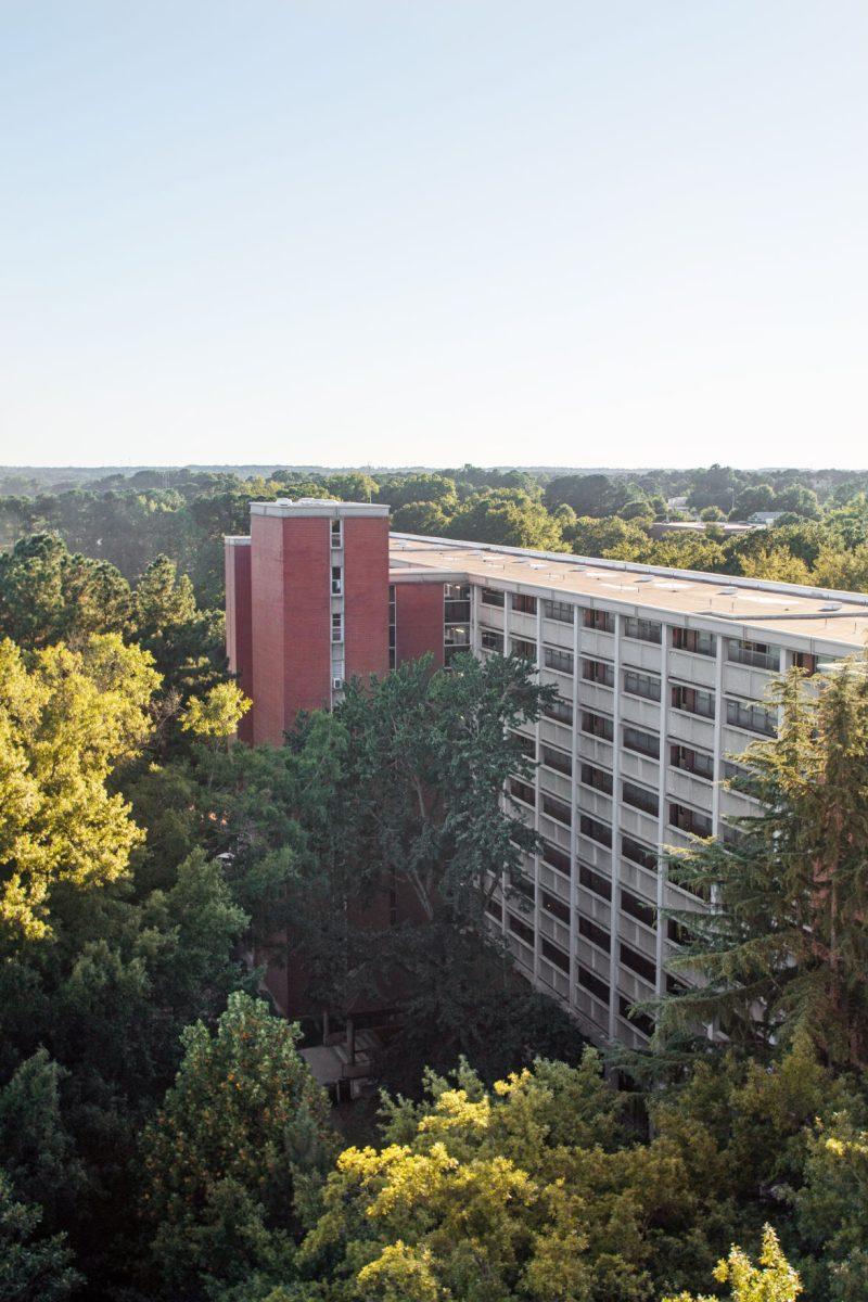 The setting sun illuminates Lee Residence Hall on Tuesday. University Housing was not prepared this August as they welcomed back an estimated 300 applicants above their original housing allotment.