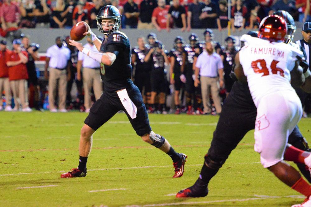 Redshirt junior quarterback Ryan Finley winds up to throw against the Louisville Cardinals. The Wolfpack would go on to win the game by a score of 39-25 in Carter-Finley Stadium on Thursday, Oct 5.