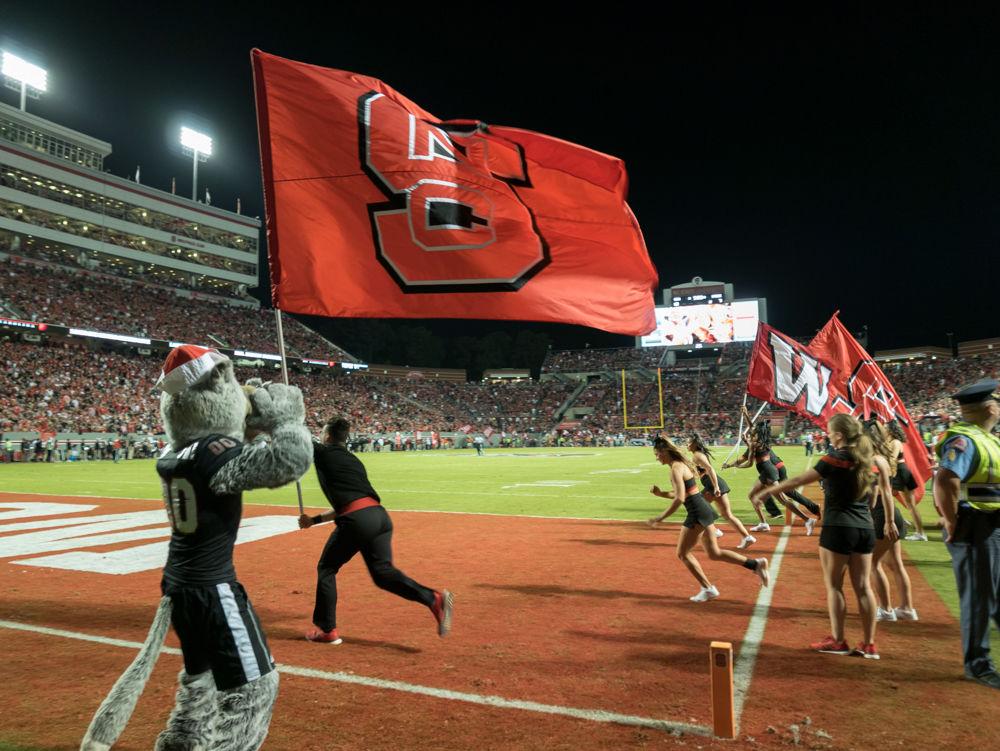 Mr Wuff howls after a touchdown in the 39-25 win over Louisville in Carter-Finley Stadium on Thursday, October 5
