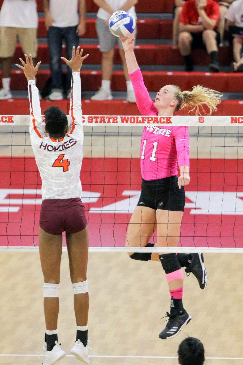 Senior outside hitter Julia Brown goes up for a spike. Brown had 12 kills in the 3-1 win over Virginia Tech on Oct. 15 in Reynolds Coliseum.