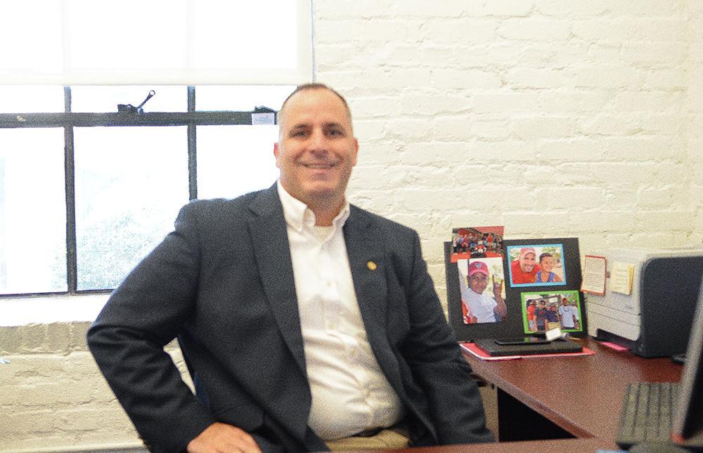 Mike Giancola, associate vice provost at NC State, sits in his office in Park Shops on Friday, Oct. 27. Giancola said he usually speaks to students at a table in his office.
