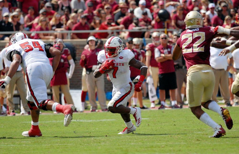 Junior running back Nyhein Hines runs the ball during the N.C. State vs. FSU football game in Doak Campbell Stadium on Saturday, Sept. 23, 2017. The Wolfpack won 27-21 over the Seminoles in their first conference win of the season.