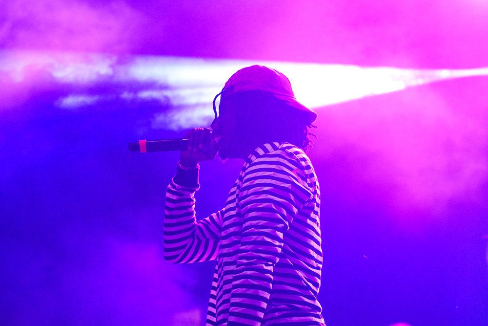 K CAMP raps as smoke and lights flood the stage. The NC State Homecoming Concert is organized by UAB as a part of Red and White week at NC State. The concert took place at Reynolds Coliseum on Friday, Oct. 27.