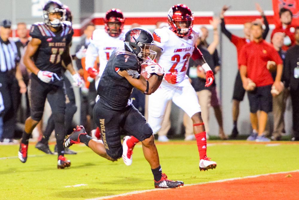 Junior running back Nyheim Hines crosses into the endzone to score during the game against Louisville. The Wolfpack downed the Cardinals 39-25 in Carter Finley Stadium on Thursday, Oct 5.