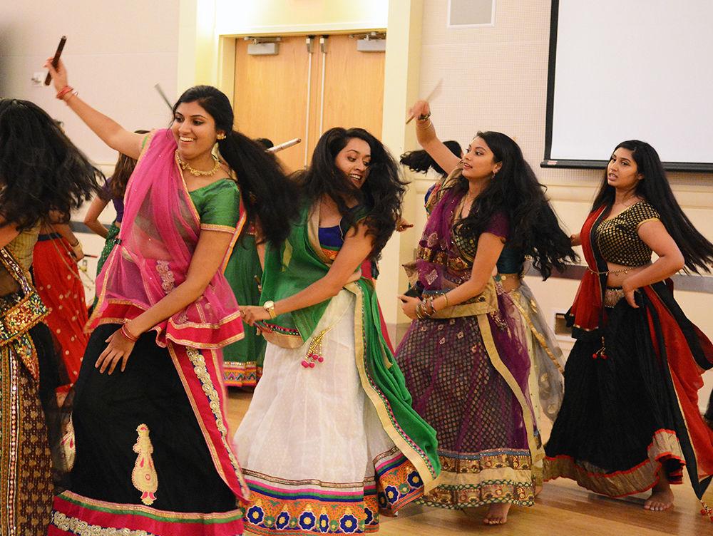 Attendees of Triangle Garba participate in a dance called Dandiya Raas Saturday in Talley Ballroom. Triangle Garba was held for attendees from NC State, Duke and UNC-Chapel Hill by NC State organization Ektaa. Shefali Shah, the co-president of Ektaa, said that the sticks used in Dandiya Raas "represent the swords of the goddess Durga.&#8221;