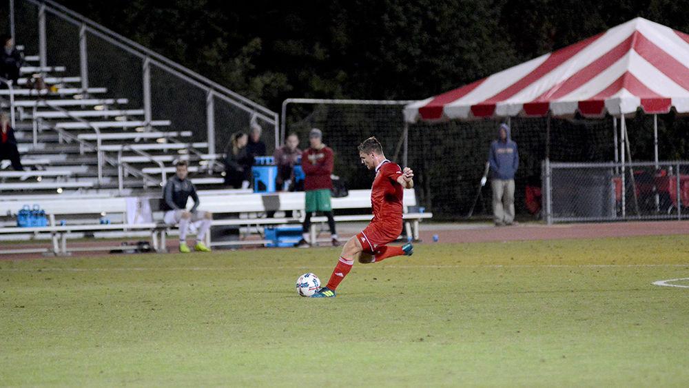 Freshman midfielder Brad Sweeney launches a free kick during the NC State vs. Boston College men's soccer game at Dail Soccer Stadium on Friday, Oct. 27. The Wolfpack drew with the Golden Eagles after overtime with a score of 0-0.