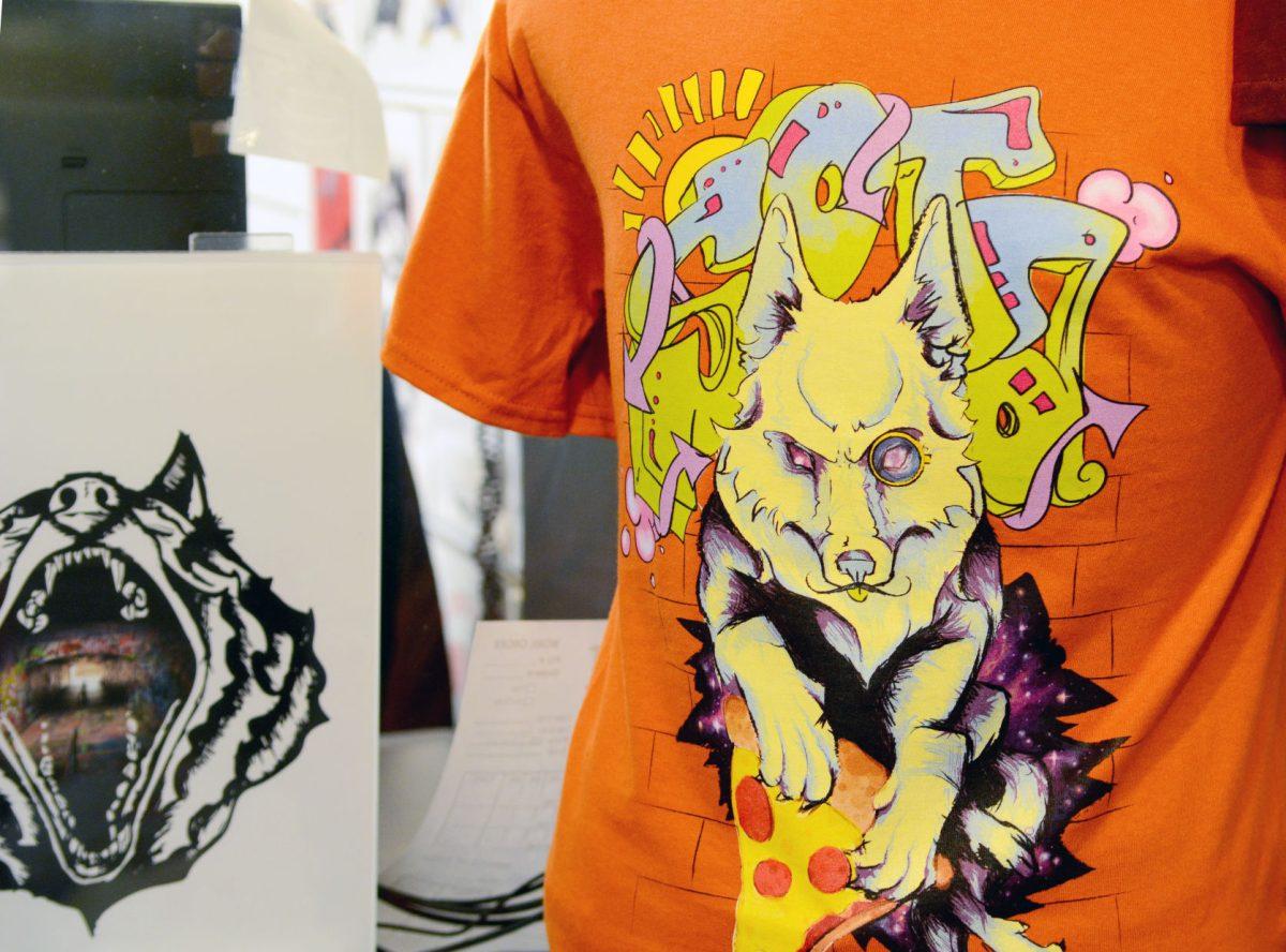 A t-shirt available for sale in State of the Art in Talley Student Union. Catalina Morris, an in-house designer for the store and a NC State graduate, said that the design was a collaboration between the store's three designers.&#160;