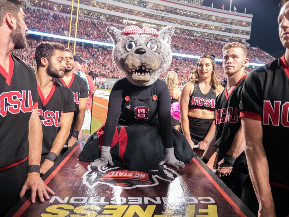 Ms Wuff prepares for a push up after a touchdown in the 39-25 win over Louisville in Carter-Finley Stadium on Thursday, October 5