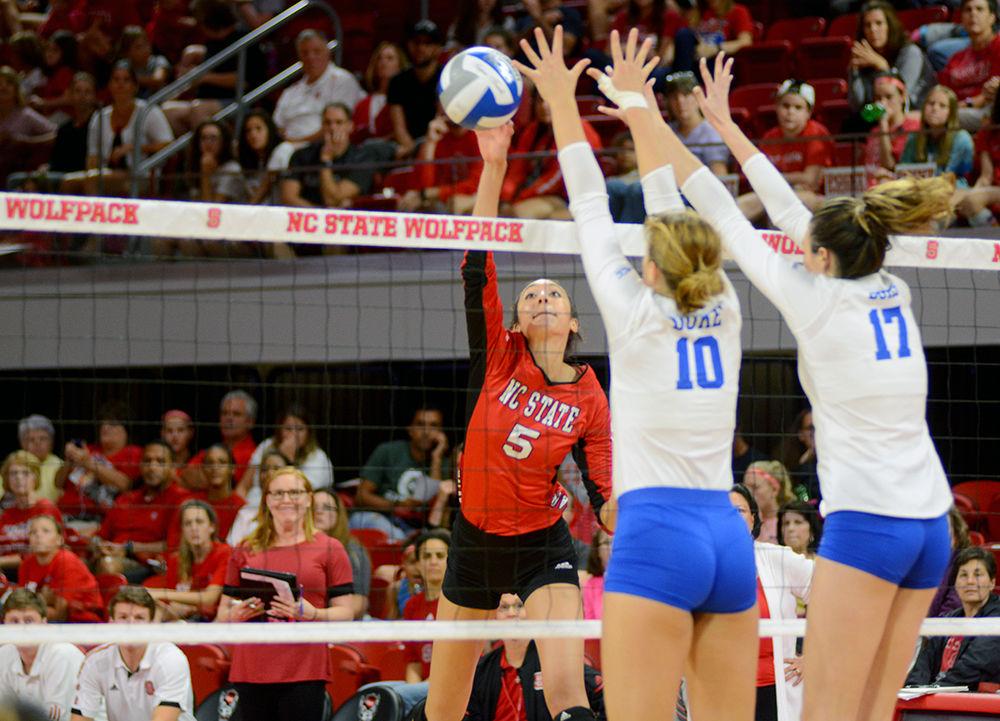 Graduate student outside hitter Bree Bailey spikes against Duke in Reynolds Coliseum on Oct. 8. State beat Duke 3 sets to 0.